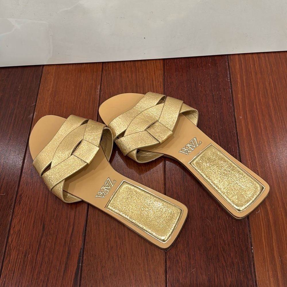 Zara gold flat crossed leather sandals.